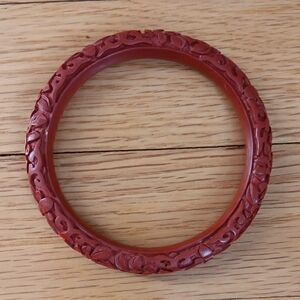Red Carved Botanical Bracelet with Intricate Design
